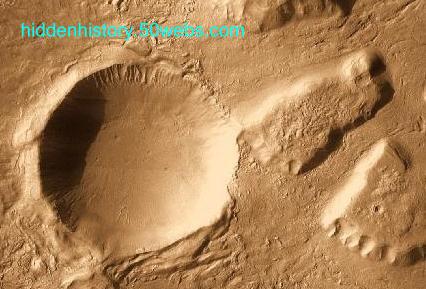 Crater with a trail, on Mars. Crater with a trail, on Mars.